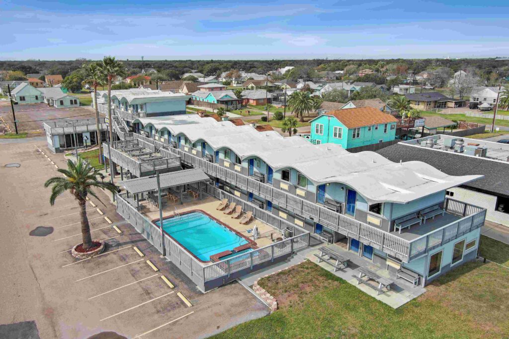 Blue Wave Inn exterior with pool and upper deck